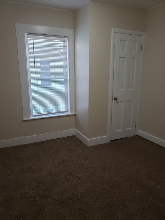 55 Tyler Street Springfield, MA 01109 - Photo 23 of 32 an empty room with a empty space and a window