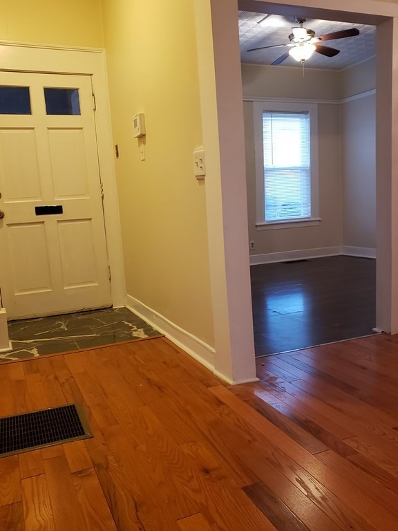 55 Tyler Street Springfield, MA 01109 - Photo 5 of 32 wooden floor in an empty room with a window