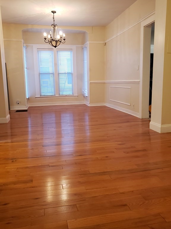 55 Tyler Street Springfield, MA 01109 - Photo 7 of 32 a view of empty room with wooden floor
