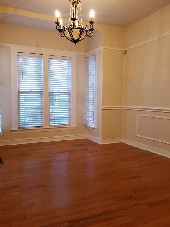 55 Tyler Street Springfield, MA 01109 - Photo 9 of 32 a view of empty room with wooden floor and fan
