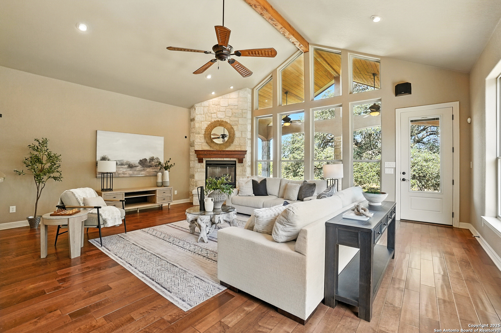 7607 Sky Loop Garden Ridge, TX 78266 - Photo 15 of 49 a living room with furniture a fireplace and a flat screen tv