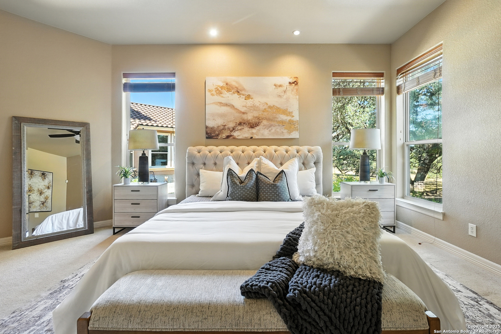 7607 Sky Loop Garden Ridge, TX 78266 - Photo 19 of 49 a spacious bedroom with a bed and glass window