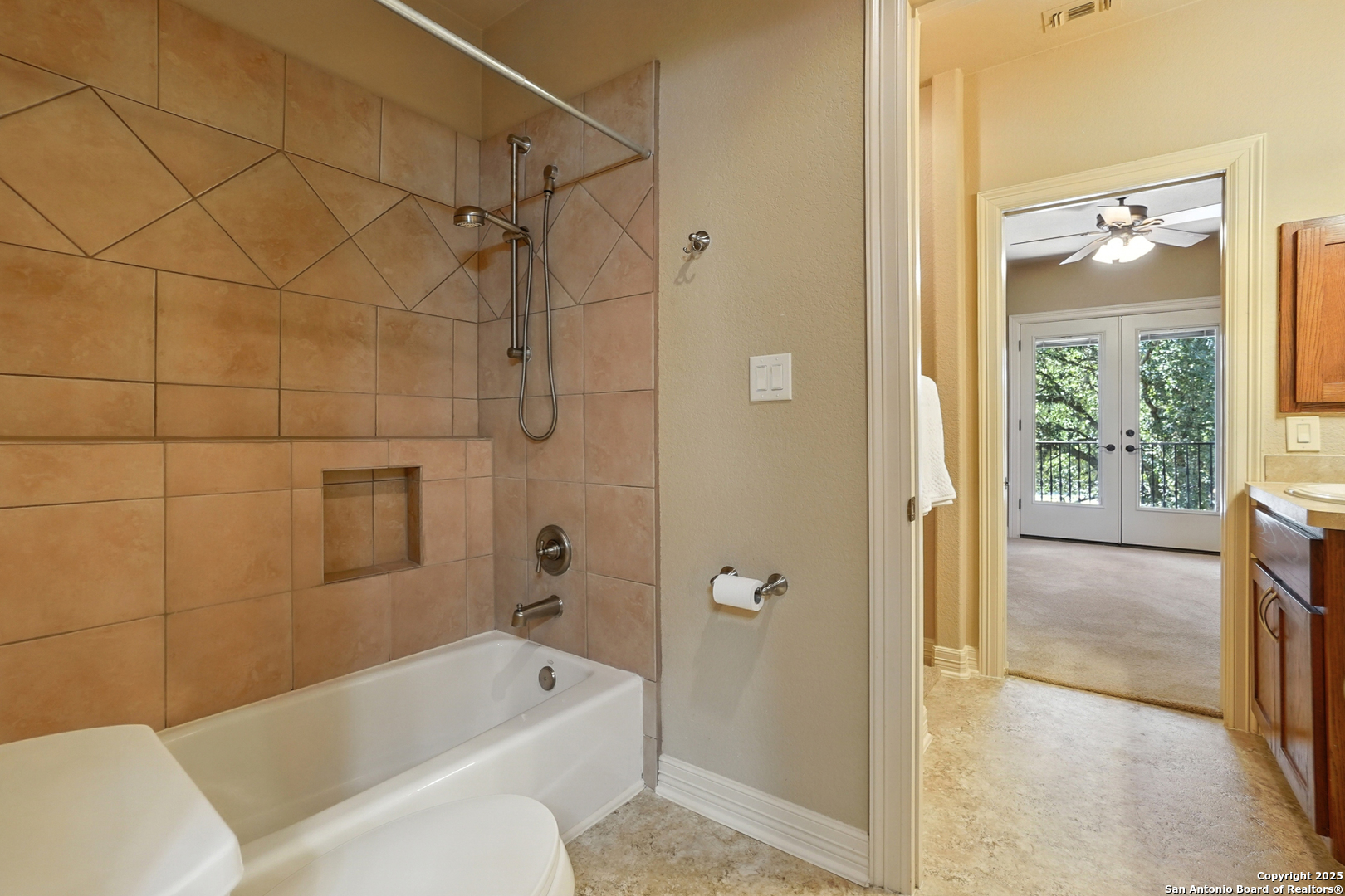 7607 Sky Loop Garden Ridge, TX 78266 - Photo 30 of 49 a bathroom with a shower a bathtub and a shower