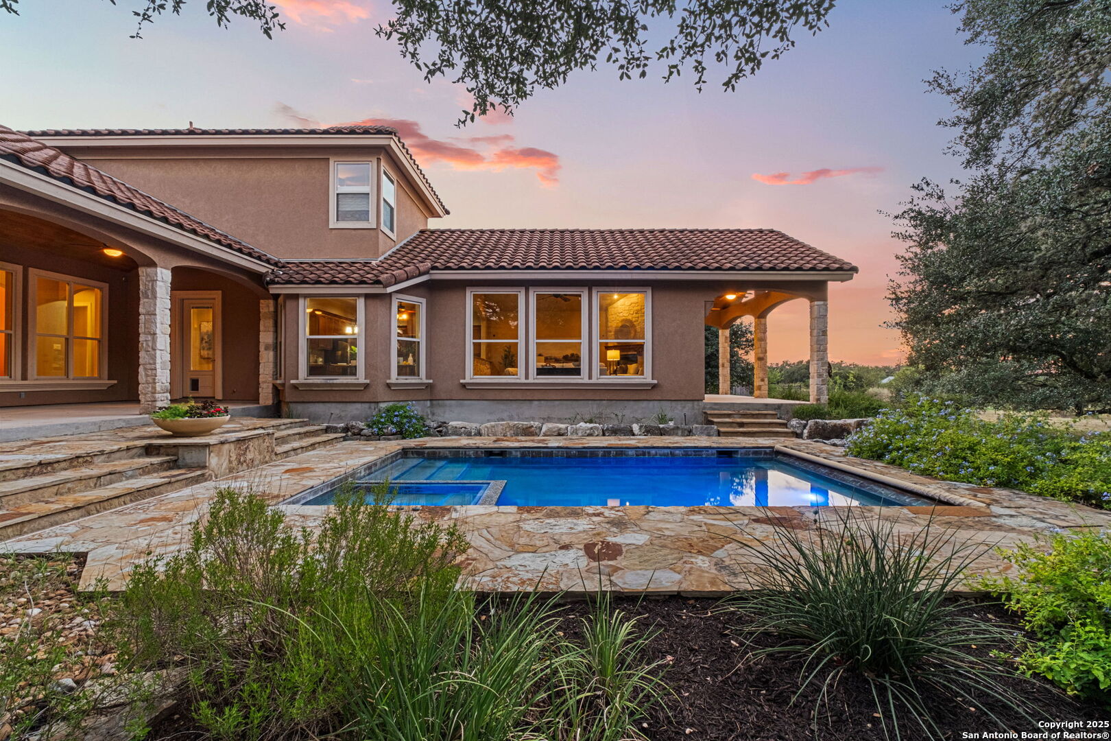 7607 Sky Loop Garden Ridge, TX 78266 - Photo 32 of 49 a front view of house with yard and outdoor seating
