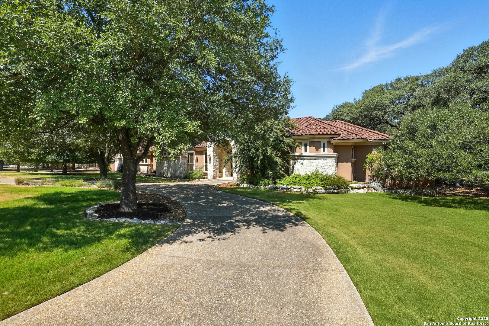 7607 Sky Loop Garden Ridge, TX 78266 - Photo 4 of 49 a front view of a house with a yard