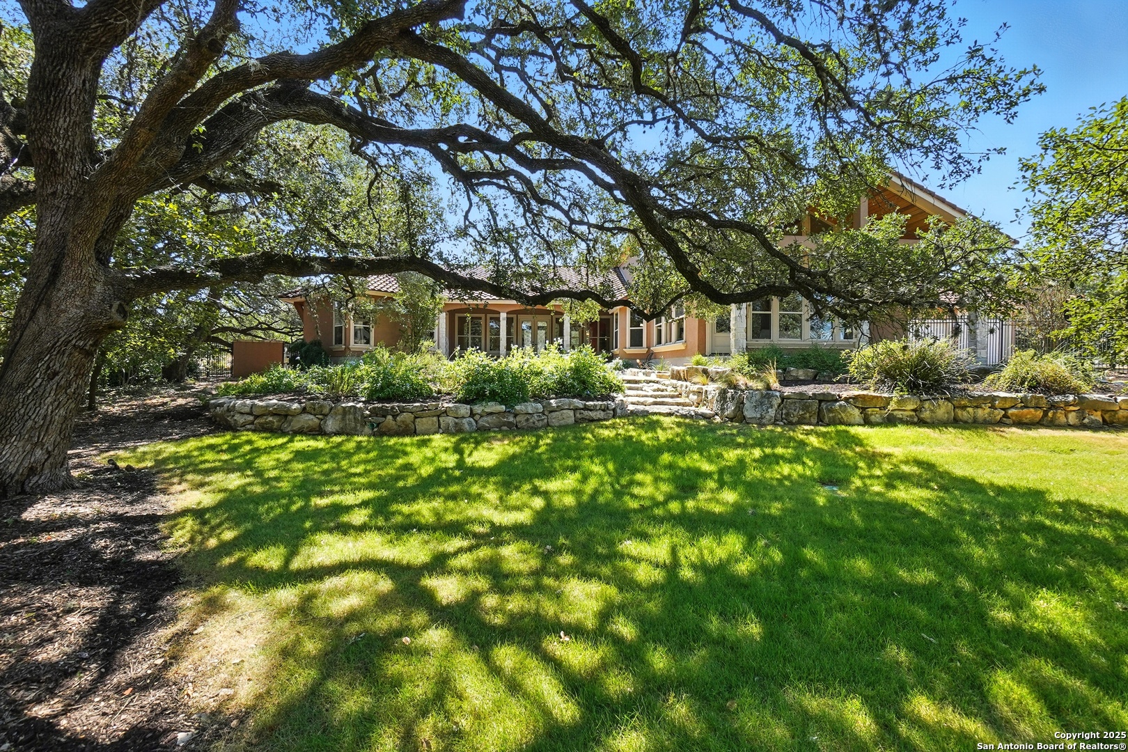 7607 Sky Loop Garden Ridge, TX 78266 - Photo 42 of 49 a front view of a house with garden
