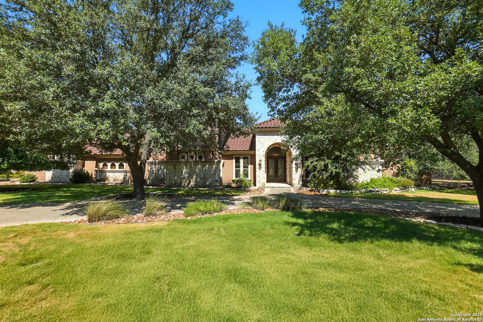 7607 Sky Loop Garden Ridge, TX 78266 - Photo 5 of 49 a view of a house with a yard