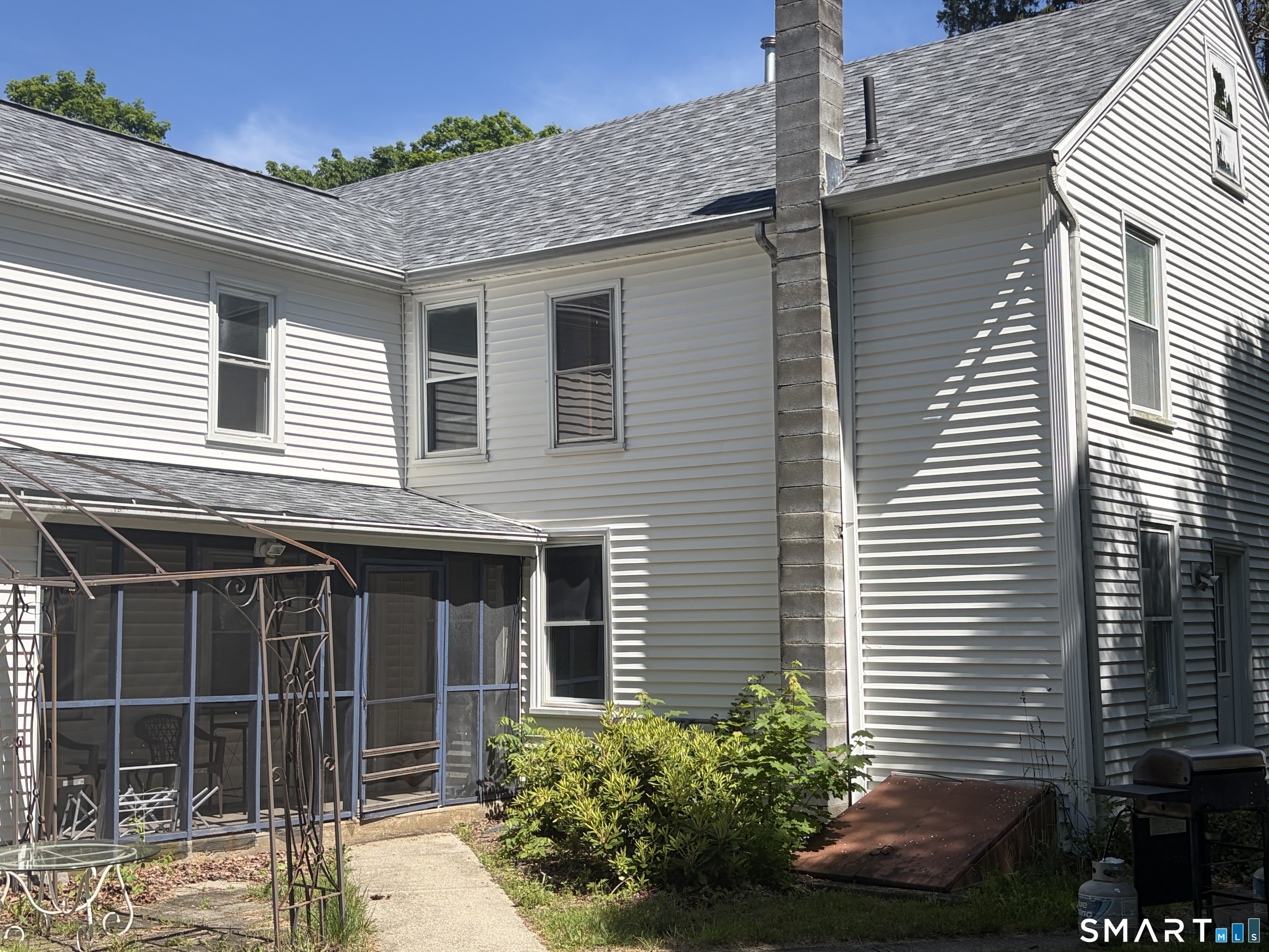 1079 Main Street Coventry, CT 06238 - Photo 4 of 19 a front view of a house with plants