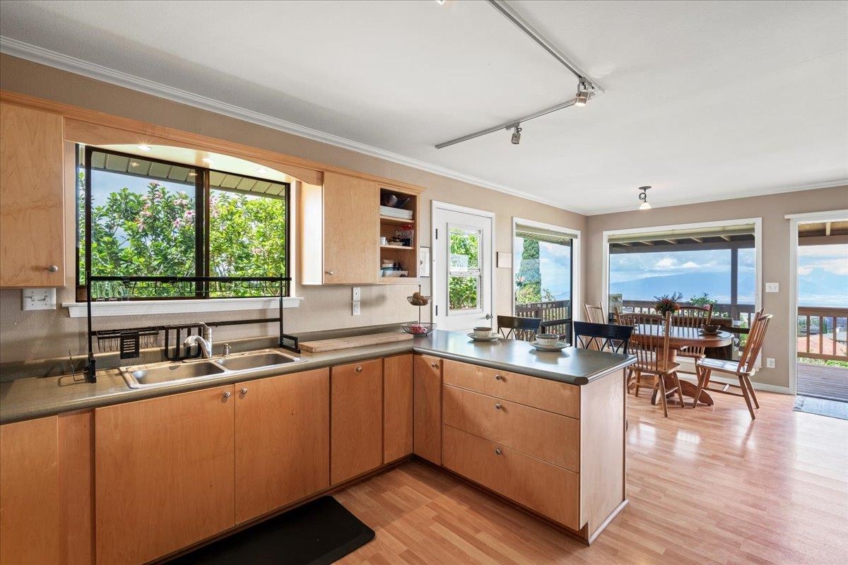 119 Ka Drive Kula, HI 96790 - Photo 1 of 45 a kitchen with sink a window and chairs