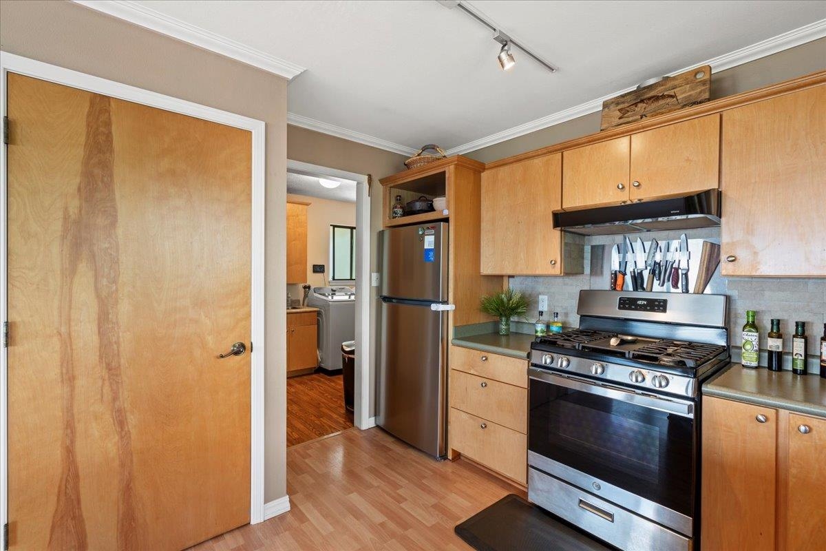 119 Ka Drive Kula, HI 96790 - Photo 21 of 45 a kitchen with stainless steel appliances a stove and a refrigerator