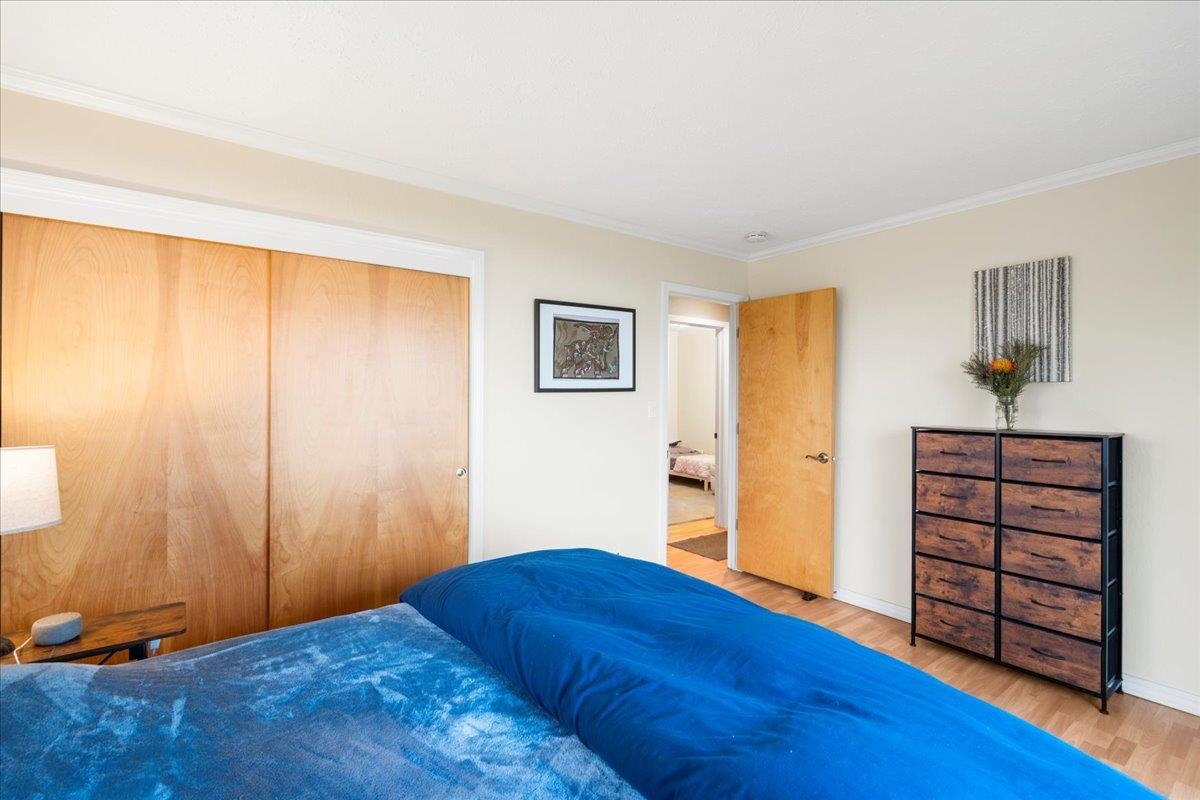 119 Ka Drive Kula, HI 96790 - Photo 24 of 45 a bedroom with a bed and wooden floor