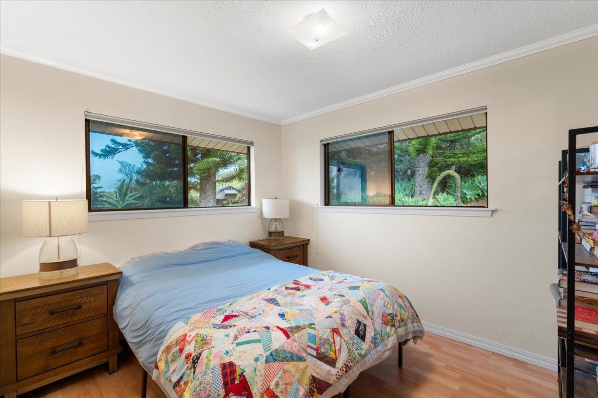 119 Ka Drive Kula, HI 96790 - Photo 31 of 45 a bedroom with a bed and a window