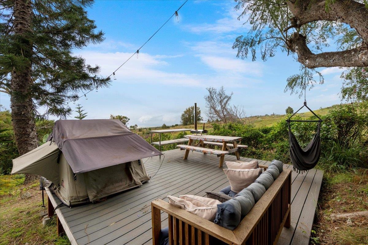 119 Ka Drive Kula, HI 96790 - Photo 40 of 45 a view of a terrace with furniture and a potted plant