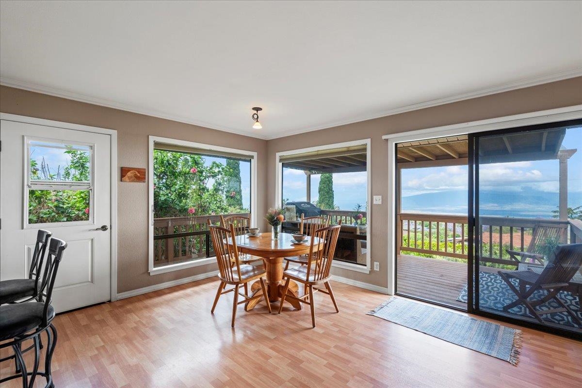 119 Ka Drive Kula, HI 96790 - Photo 8 of 45 a view of a dining room with furniture window and wooden floor