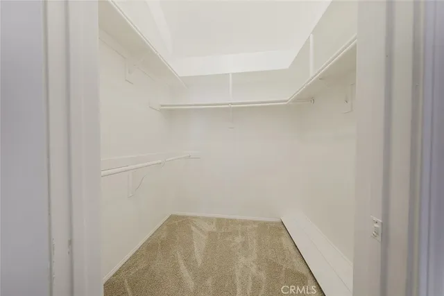 a spacious bathroom with a granite countertop sink mirror and a bathtub