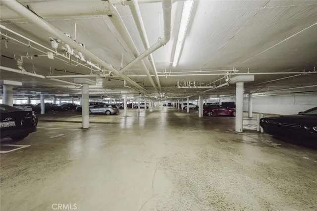 a living room with furniture large window and a fireplace