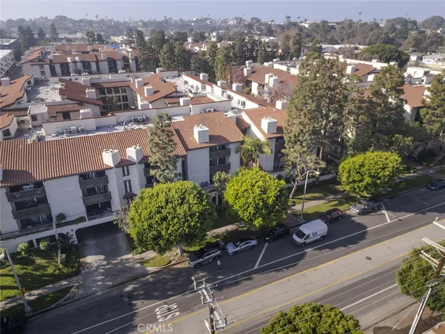 a view of a kitchen with a sink and a refrigerator