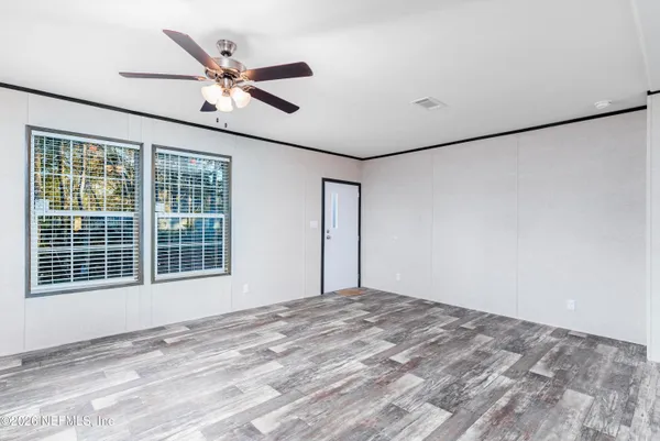 a view of an empty room with a window