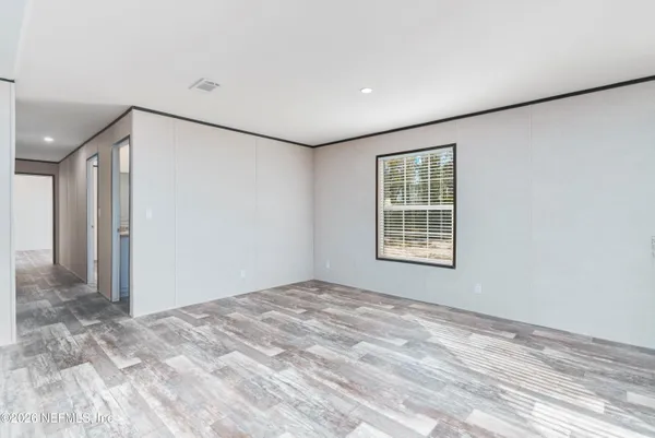 a view of an empty room with a window