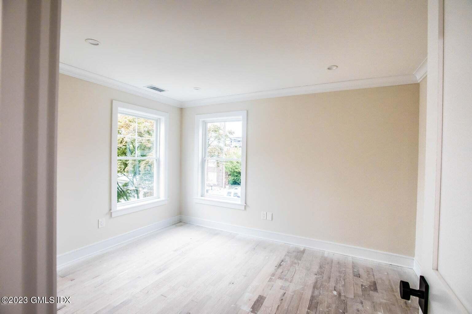 292 Delavan Avenue, Unit 2 Greenwich, CT 06830 - Photo 15 of 22 a view of an empty room with a window