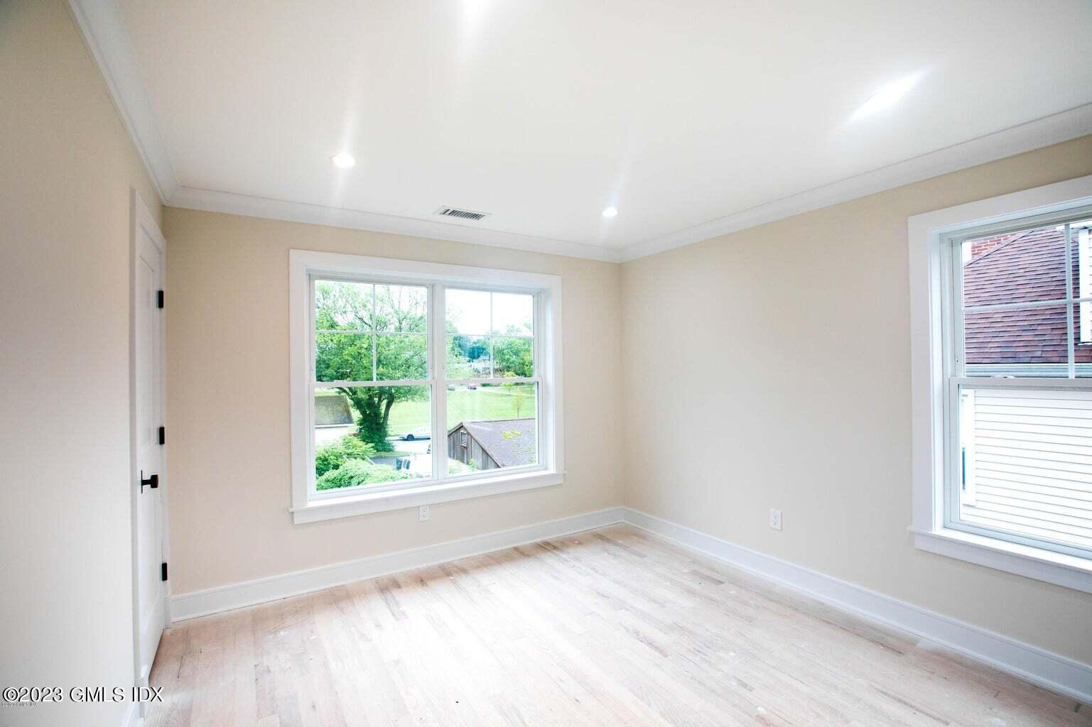 292 Delavan Avenue, Unit 2 Greenwich, CT 06830 - Photo 16 of 22 an empty room with windows