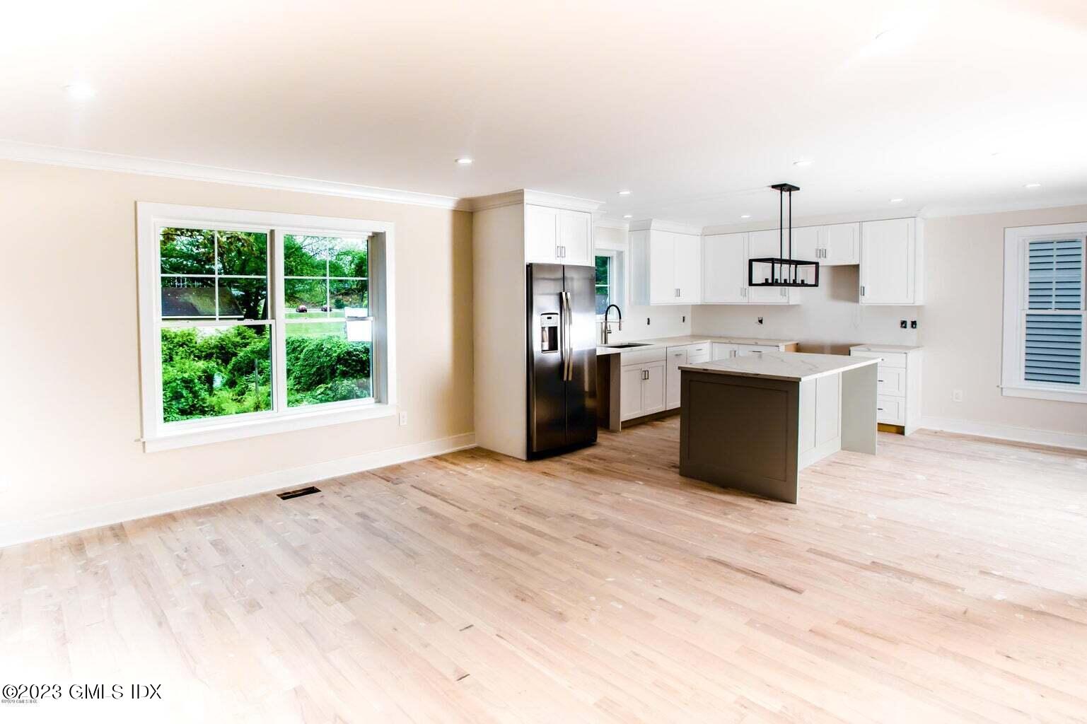 292 Delavan Avenue, Unit 2 Greenwich, CT 06830 - Photo 21 of 22 a view of kitchen with stainless steel appliances granite countertop a refrigerator and a sink