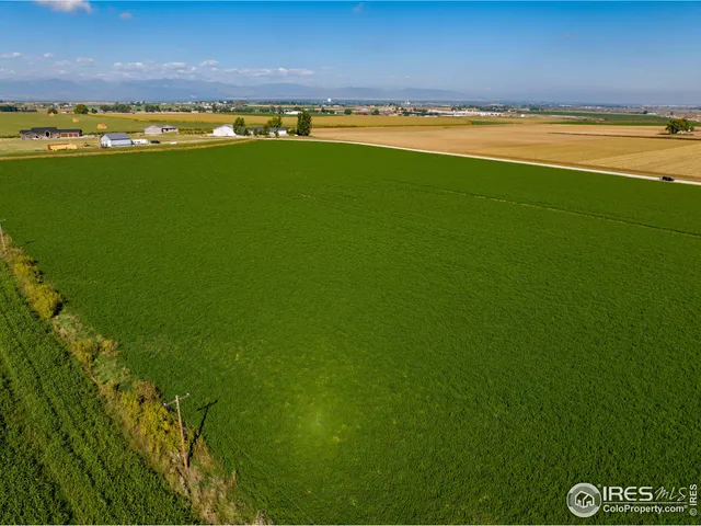 a view of an ocean and a houses