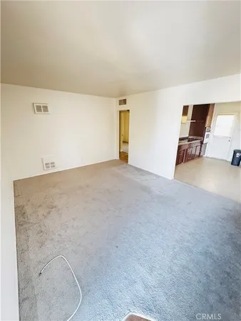 an empty room with furniture