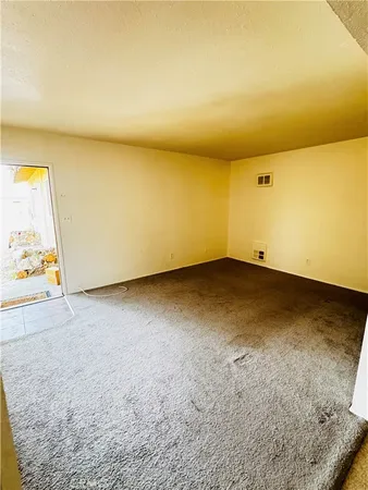 an empty room with a hard wood floor