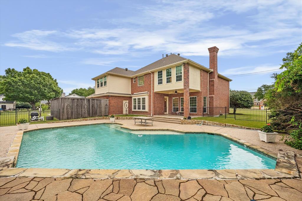 506 Meadowview Road Heath, TX 75032 - Photo 25 of 32 a view of a house with swimming pool and sitting area