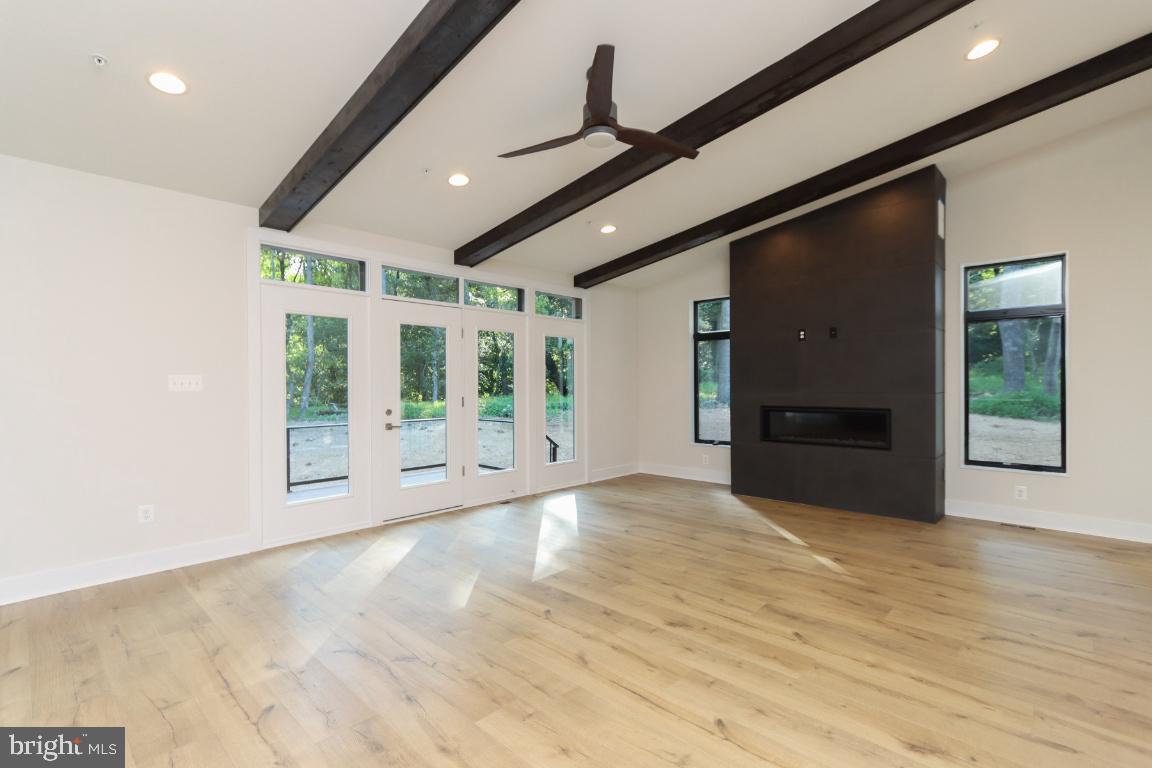 2127 Dixon Road Frederick, MD 21704 - Photo 8 of 34 Wood beams and stunning fireplace.