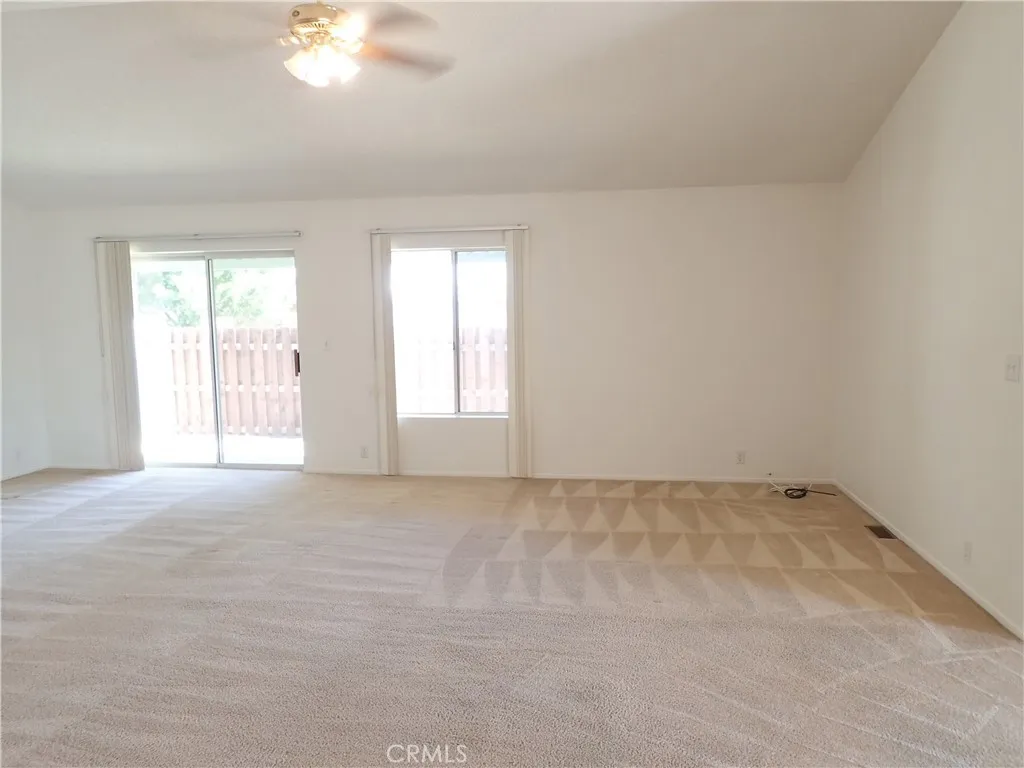 27250 Murrieta Road, Unit 332 Menifee, CA 92586 - Photo 12 of 26 an empty room with windows
