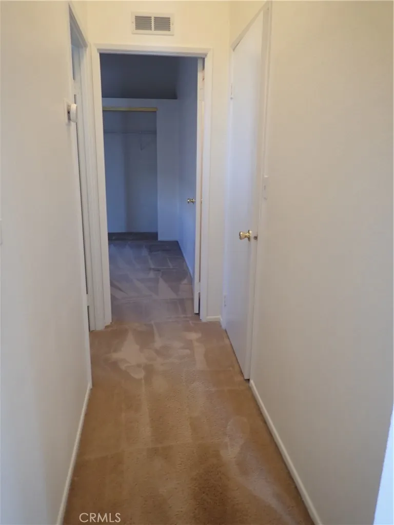27250 Murrieta Road, Unit 332 Menifee, CA 92586 - Photo 13 of 26 a view of a hallway with a closet