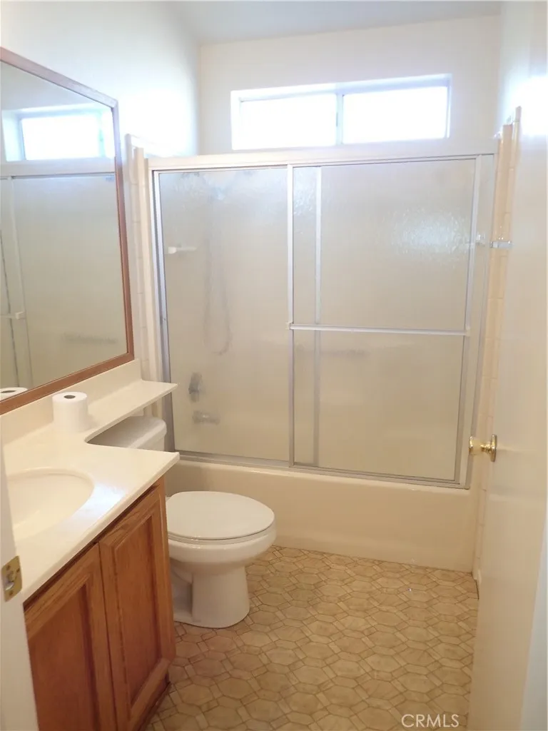 27250 Murrieta Road, Unit 332 Menifee, CA 92586 - Photo 16 of 26 a bathroom with a granite countertop sink toilet and shower