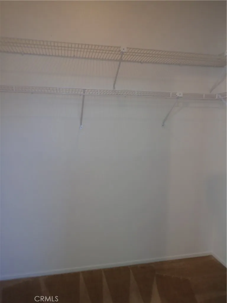 27250 Murrieta Road, Unit 332 Menifee, CA 92586 - Photo 20 of 26 a view of small space with racks on the wall