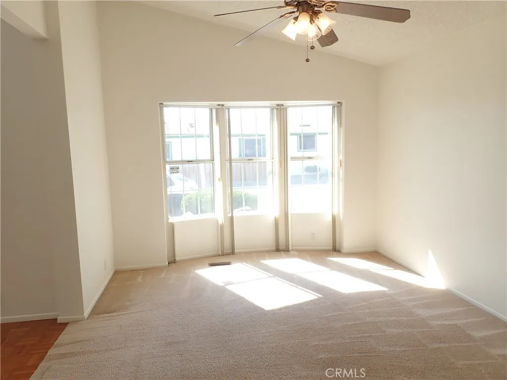 27250 Murrieta Road, Unit 332 Menifee, CA 92586 - Photo 8 of 26 a view of an empty room with a window
