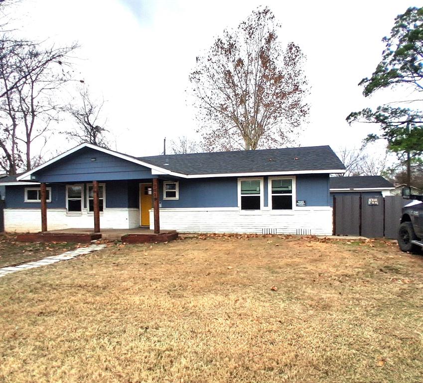 front view of a house with a yard