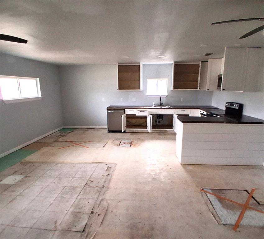 7019 Darling Street Azle, TX 76020 - Photo 6 of 19 a kitchen with a stove and a microwave