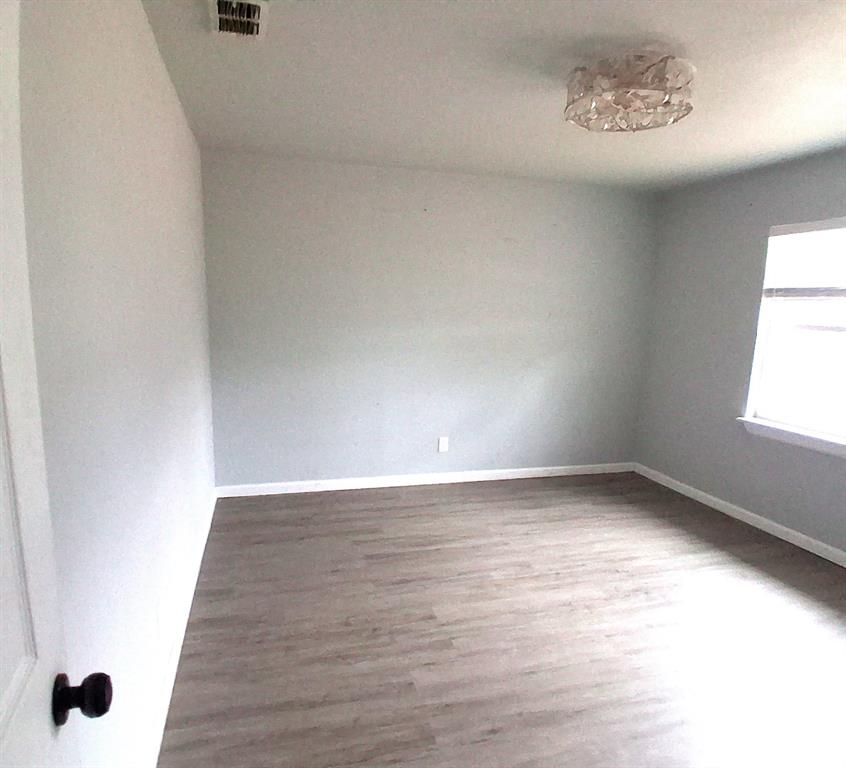 7019 Darling Street Azle, TX 76020 - Photo 9 of 19 a view of an empty room and window