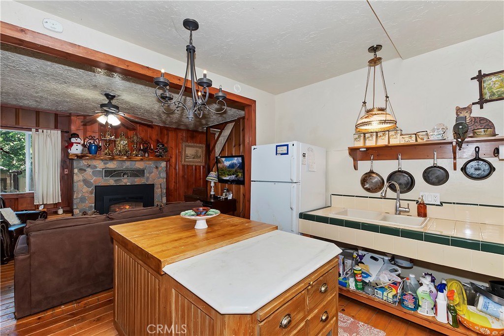 29591 Hook Creek Road Cedar Glen, CA 92321 - Photo 16 of 43 a view of a dining room with furniture and chandelier