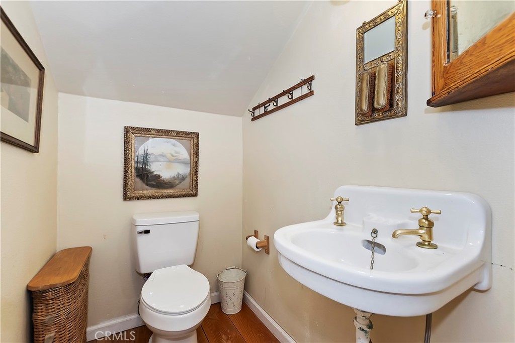 29591 Hook Creek Road Cedar Glen, CA 92321 - Photo 27 of 43 a bathroom with a toilet and a sink
