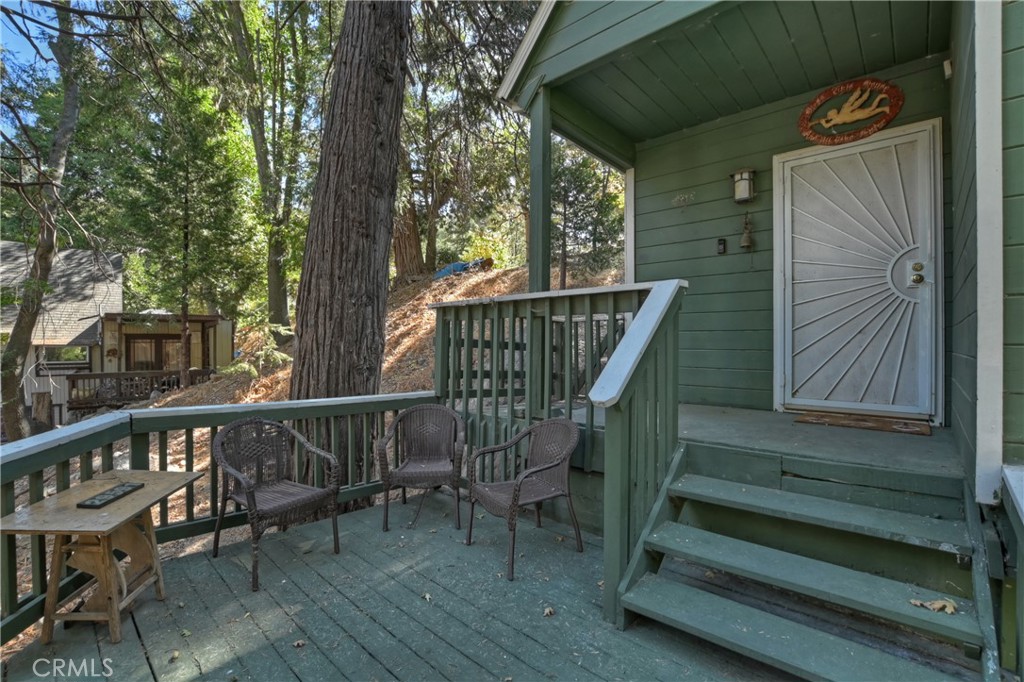 29591 Hook Creek Road Cedar Glen, CA 92321 - Photo 29 of 43 a view of balcony with wooden floor and outdoor seating