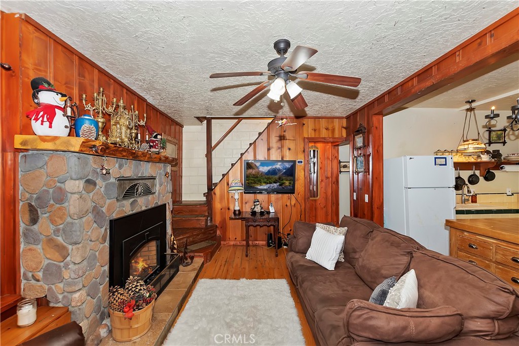29591 Hook Creek Road Cedar Glen, CA 92321 - Photo 4 of 43 a living room with furniture and a fireplace