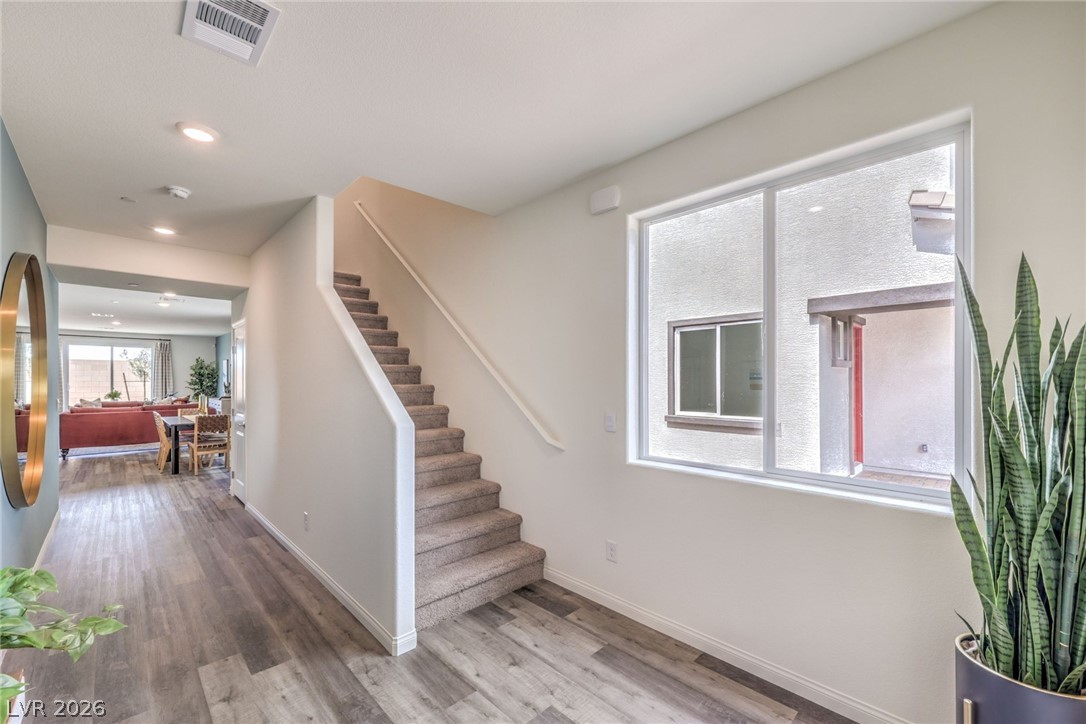 1017 Copper Robin Street Henderson, NV 89011 - Photo 5 of 43 Stairs with wood finished floors, baseboards, and recessed lighting