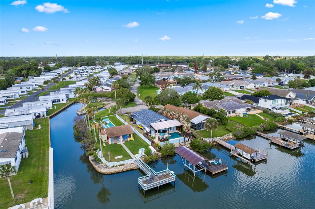 29 Pelican Lane Edgewater, FL 32141 - Photo 35 of 39 an aerial view of a swimming pool with outdoor seating