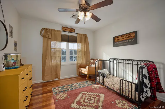a bedroom with furniture and a window