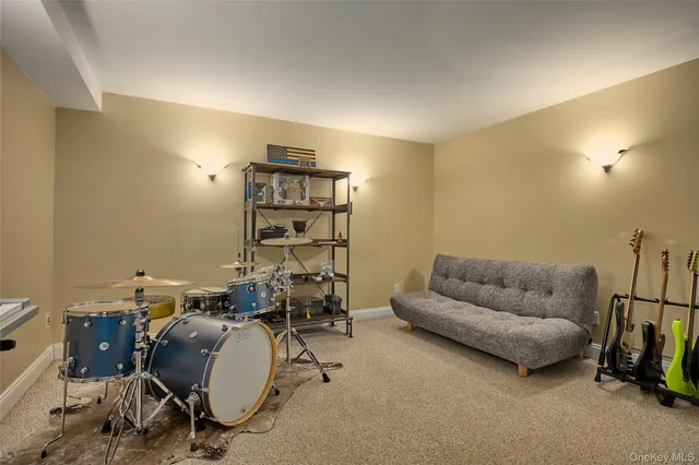 a living room with furniture a air conditioner vent and a window