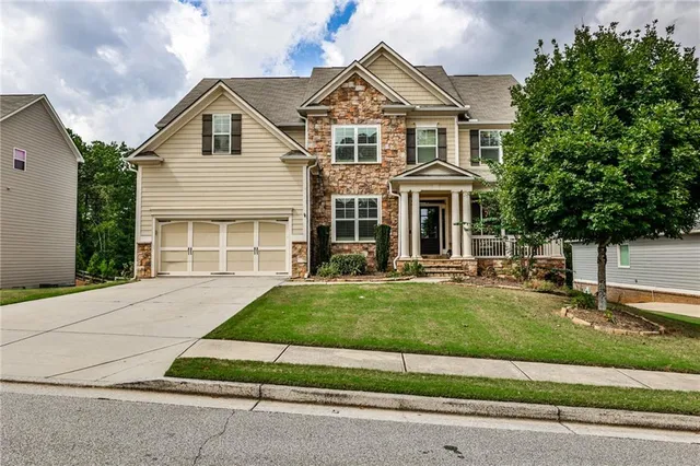 front view of a house with a yard