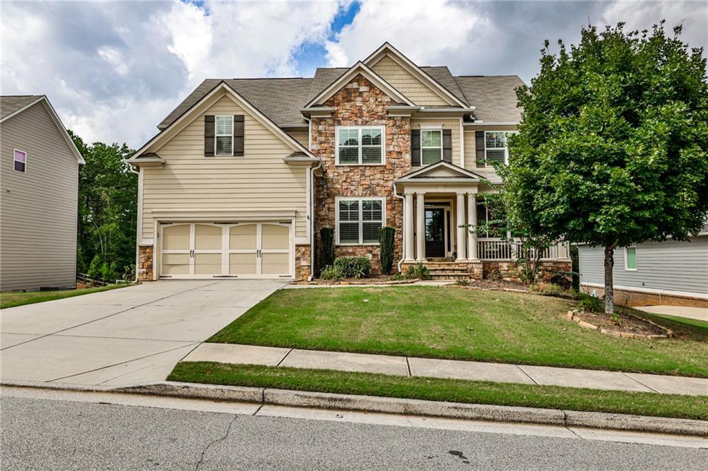 front view of a house with a yard