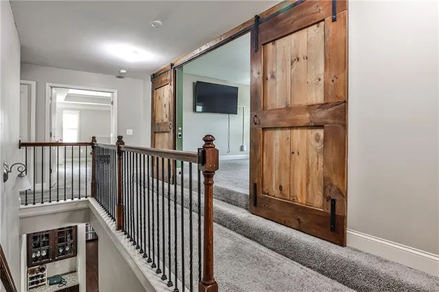 a view of a porch with wooden floor and windows